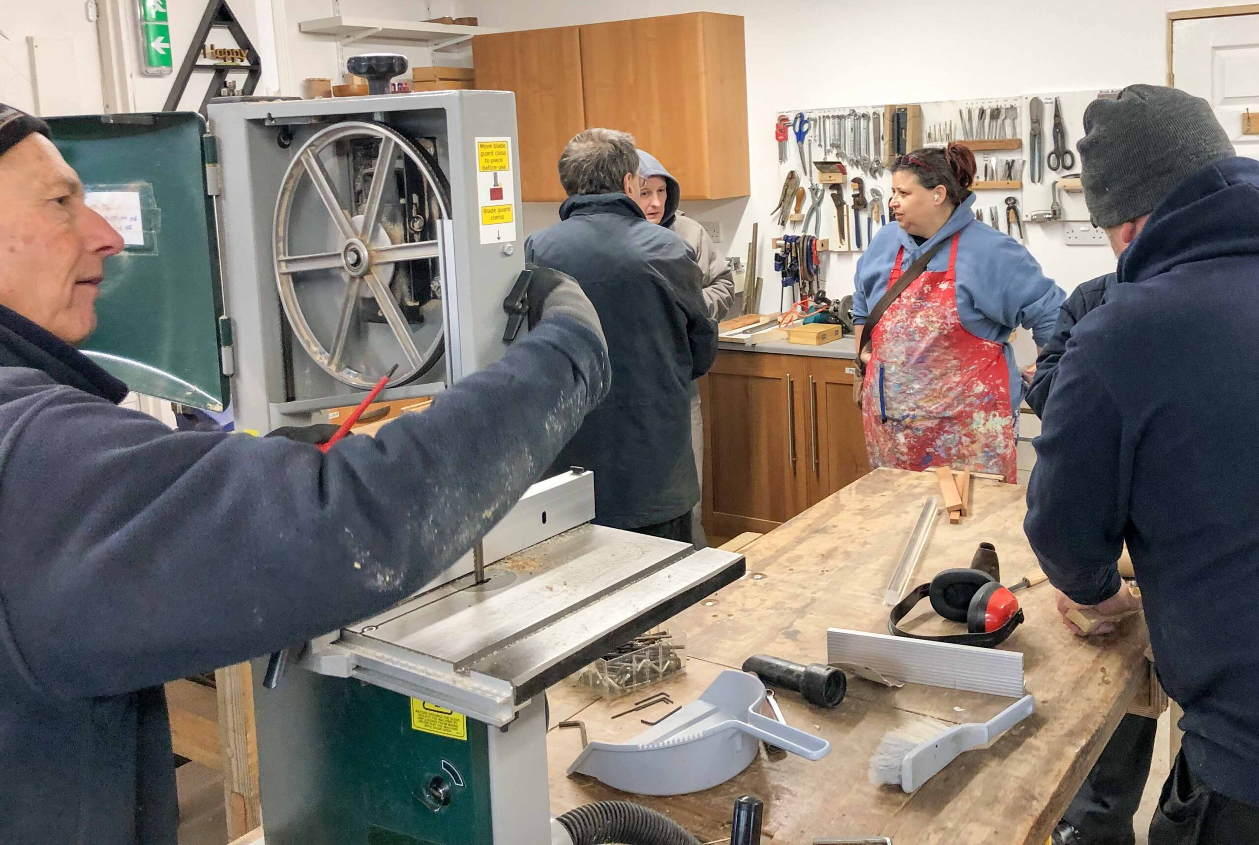 Brian fixing new bandsaw drivebelt